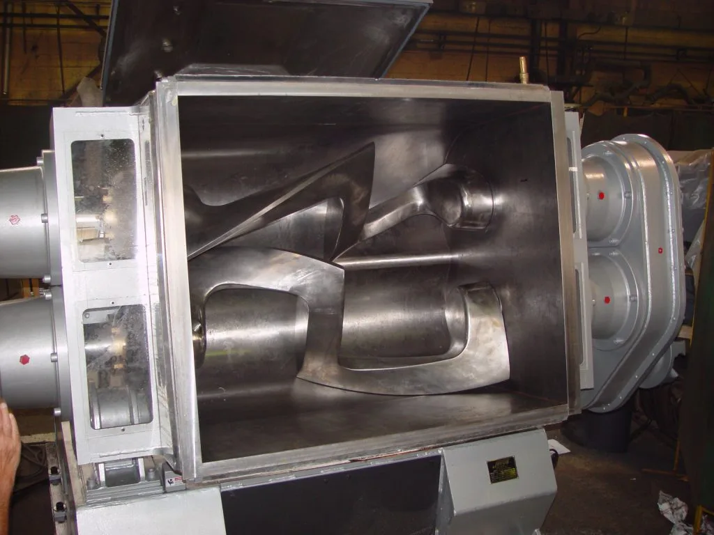 An open Sigma mixer trough with polished overlapping Z-blades inside, at the Gear Force Machine shop.