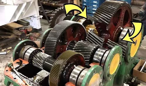 A worn Hamilton gearbox gear train with wear before rebuild.