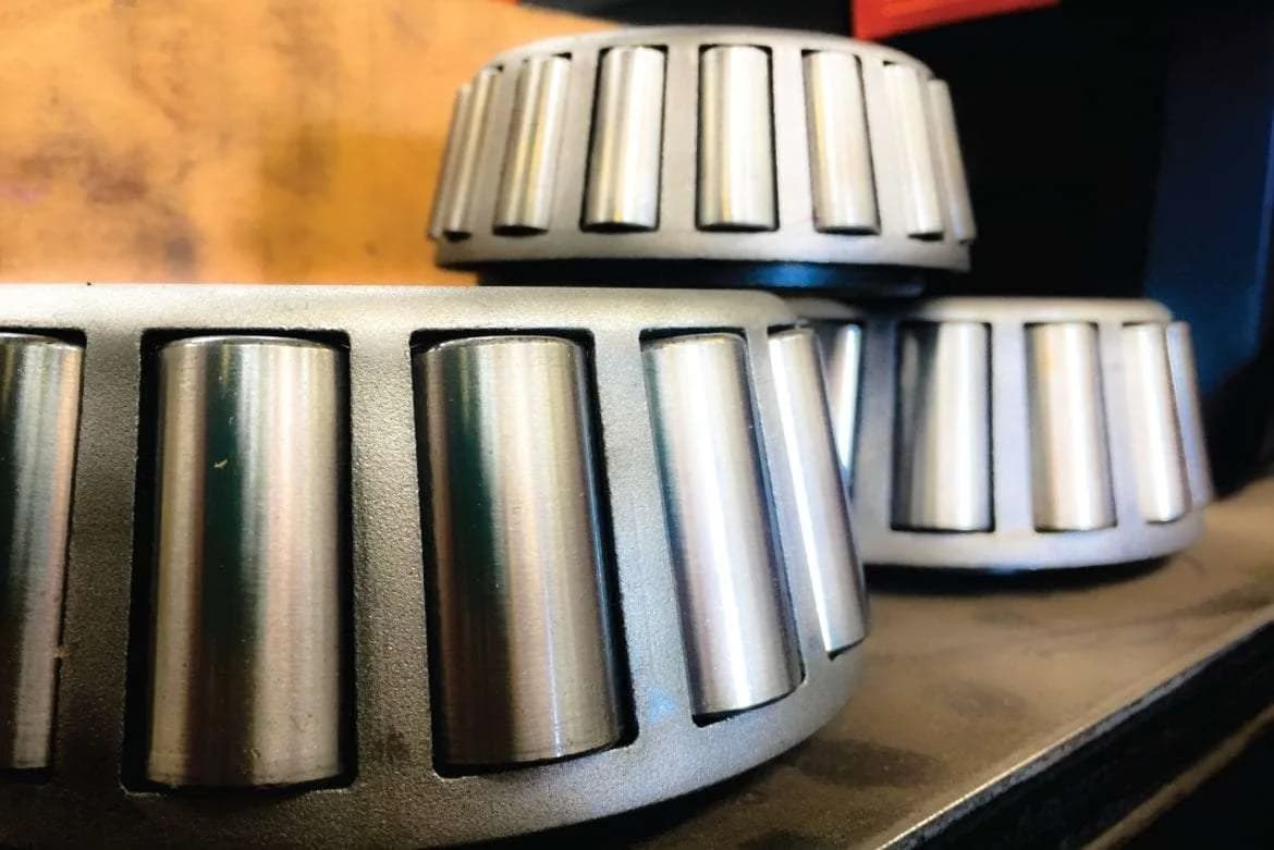 A clean close-up of tapered roller bearings staged for a gearbox rebuild.