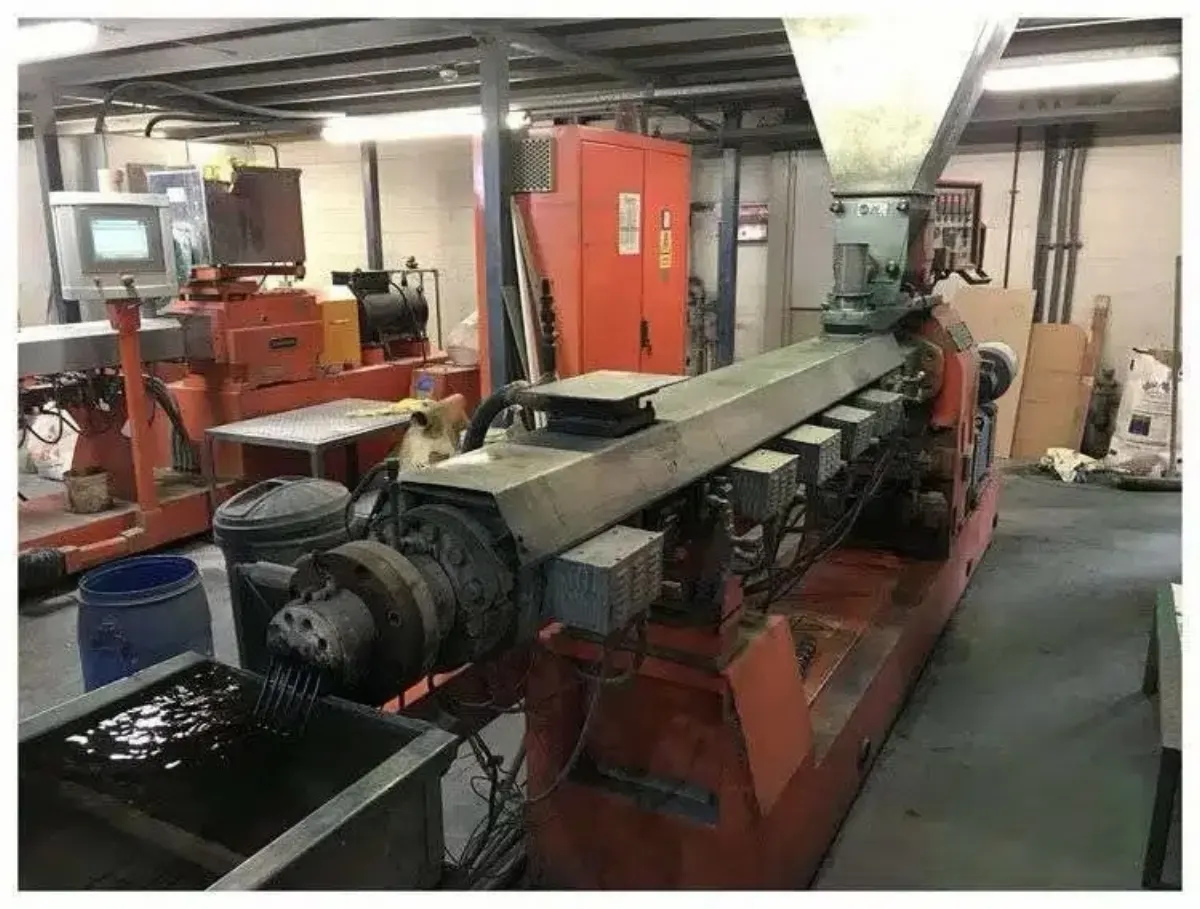 A twin-screw extruder in a plastics compounding plant, documented before Gear Force rebuild intake.