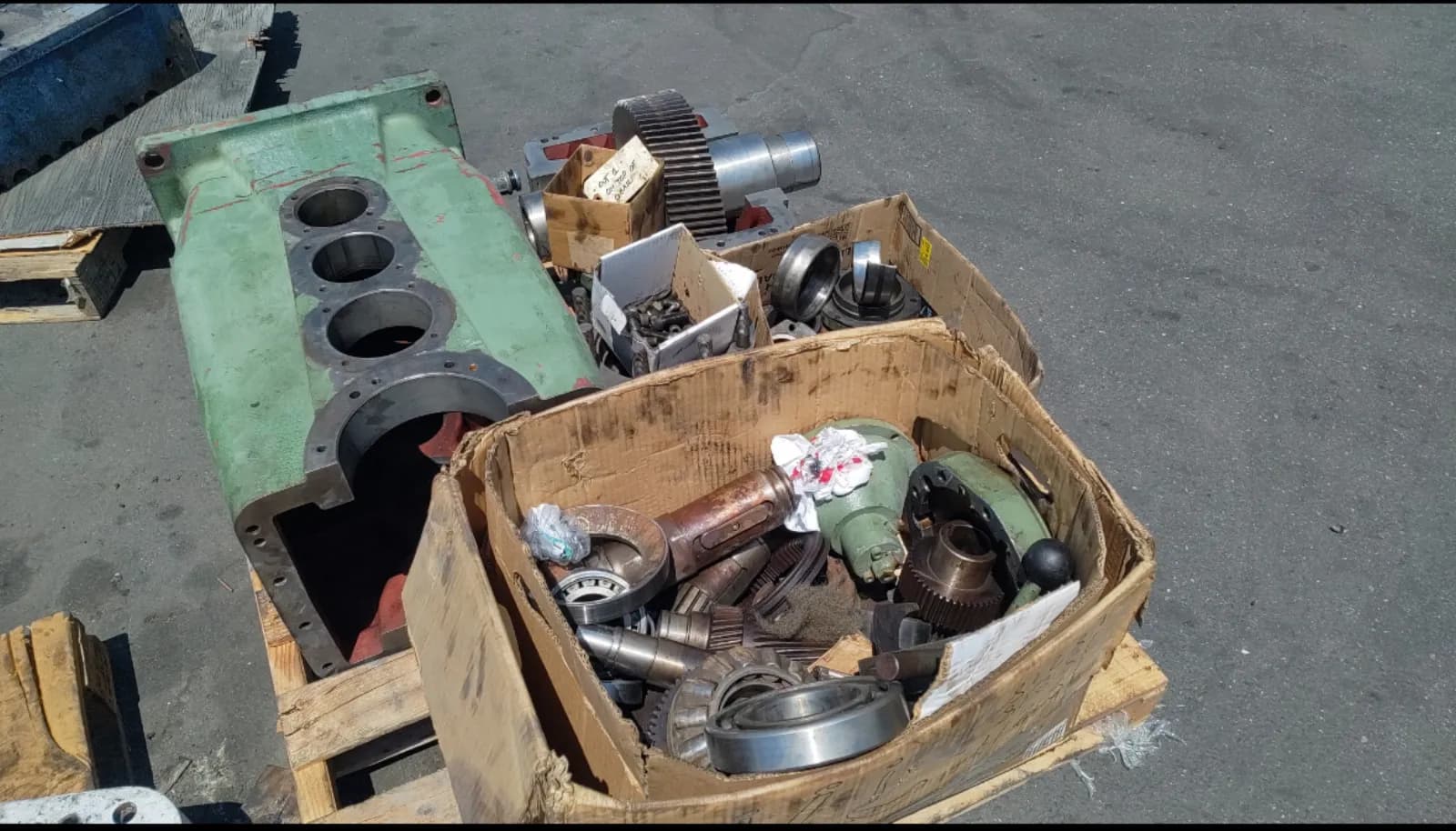 Close-up inspection of a machined red gearbox housing interior with the gear stack exposed at Gear Force Machine.